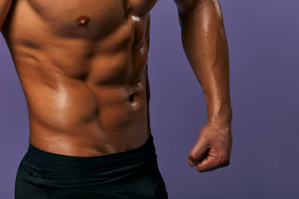 Cropped image of fit slim man showing six pack abs - Foto, Imagem