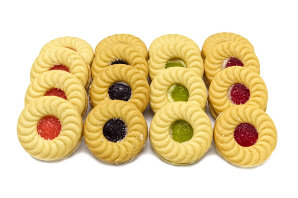 Biscuit sandwich butter cookies with cream and mixed fruits flavoured jam. A stack of crunchy delicious sweet meal and useful cracker. isolated on white background. Soft focus. - Photo, Image