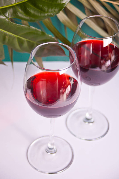Two glasses with red grape wine. Romantic dinner concept. - Foto, immagini
