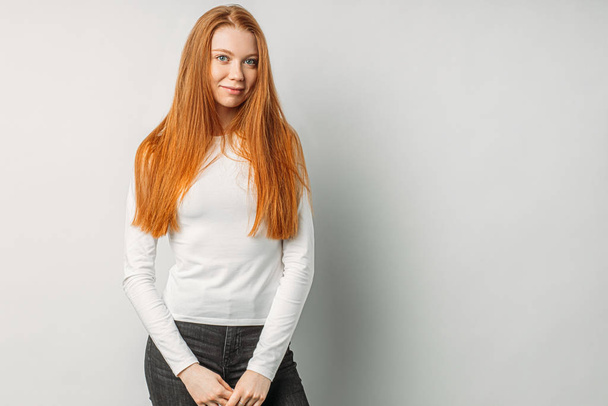 young and beautiful red haired girl isolated over white background - Φωτογραφία, εικόνα