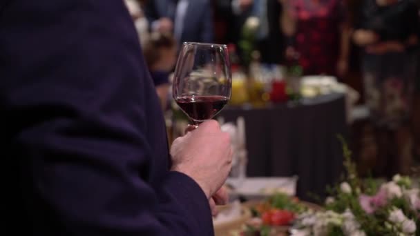 Man with glass of sparkling wine at the party - Materiaali, video