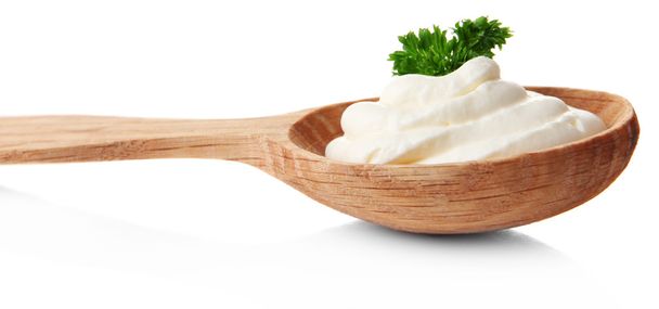 Sour cream in spoon isolated on white - Fotografie, Obrázek