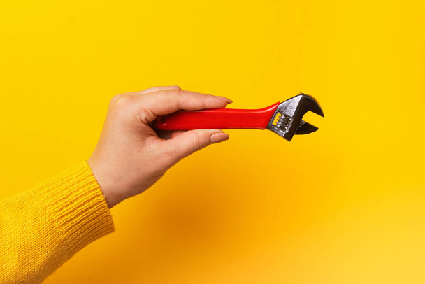 wrench in female hand - Foto, Imagem