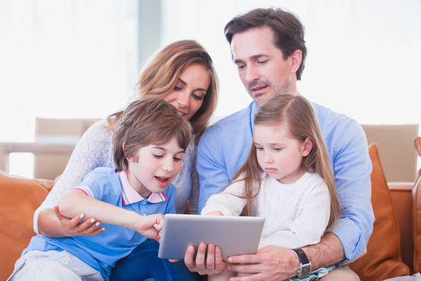 Happy family with tablet pc - Фото, изображение