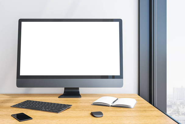 Designer desktop with empty white computer screen - Foto, afbeelding