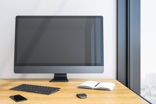 Designer desktop with empty black computer screen - Foto, Bild
