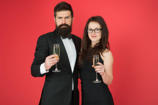 Family celebrate Valentines day. Romantic relationship. Love concept. Celebrating their love. Occasion to celebrate. Couple in love drink sparkling wine. Attractive woman bearded man raise glasses - Fotó, kép