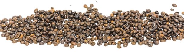 Horizontal view heap of roasted Vietnamese robusta coffee beans isolated - Photo, Image