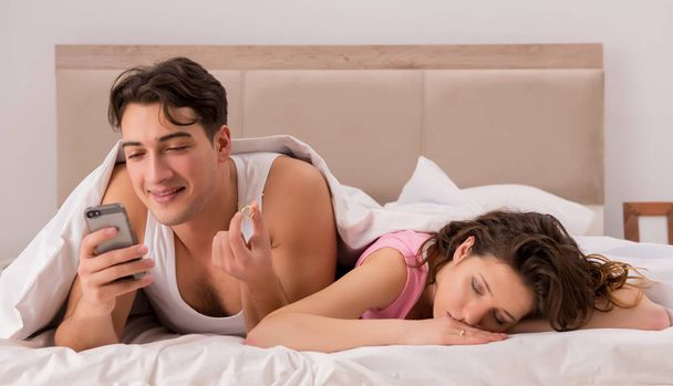 Family conflict with wife husband in bed - Photo, Image