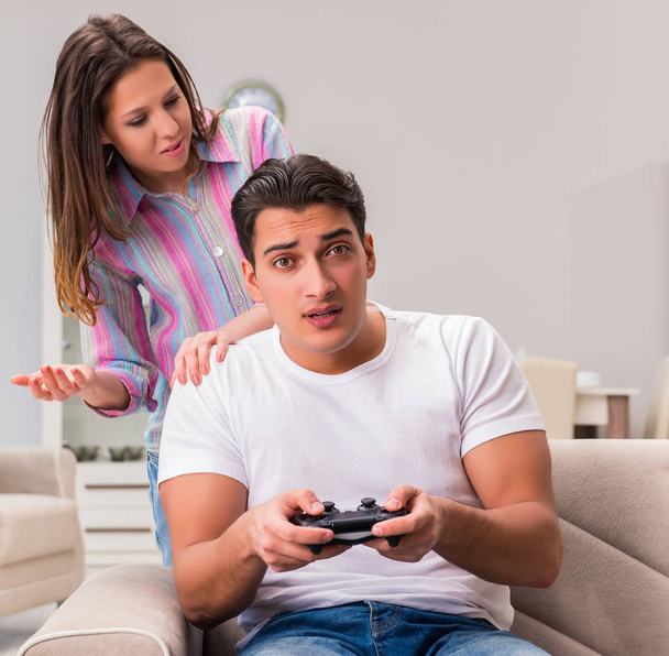 Young family suffering from computer games addiction - Photo, image