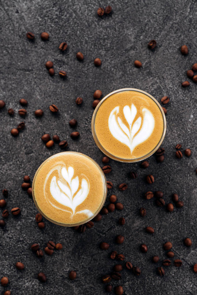 two cups of coffee on black stone background - Photo, Image