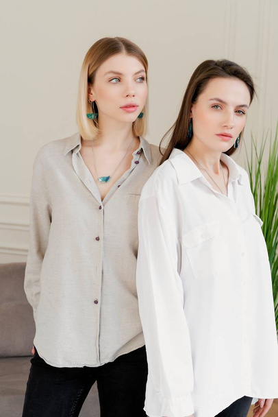 fashion portrait of two young pretty women in the studio - Foto, Imagem