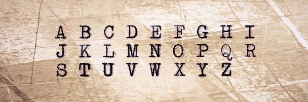 Alphabet written with an old typewriter on old paper sheet. Panoramic image - Fotoğraf, Görsel