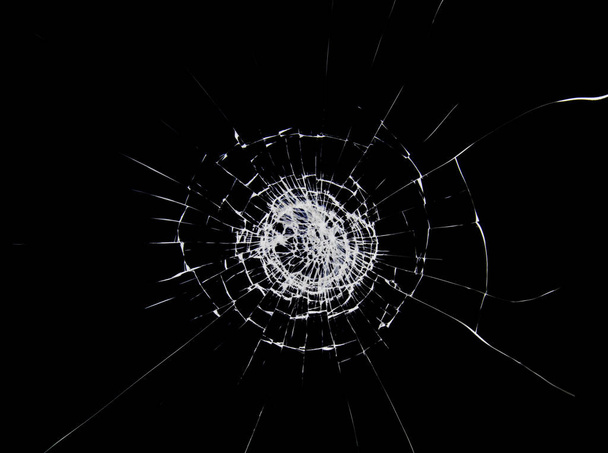 Cracks and lines on broken glass. Cracks texture on the window. - Foto, imagen