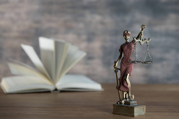 closeup view of Themis sculpture with scale on table, jurisprudence concept - Photo, Image