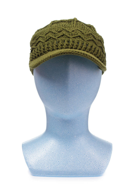 knitted hat on mannequin head isolated on white background - 写真・画像