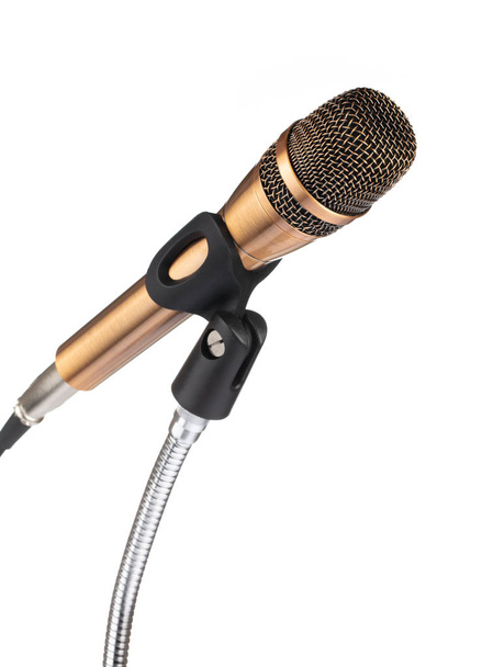 Золотой микрофон на стенде изолирован на белом фоне
 - Фото, изображение