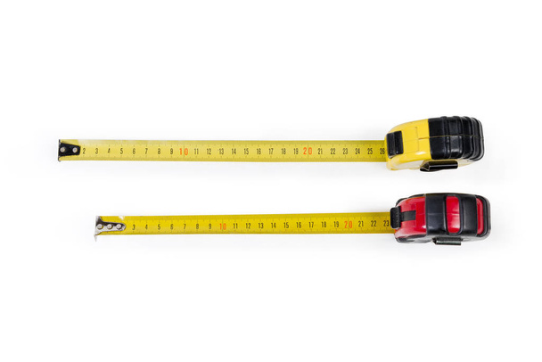 Dos cinta métrica autorretráctil con escalas métricas
 - Foto, Imagen