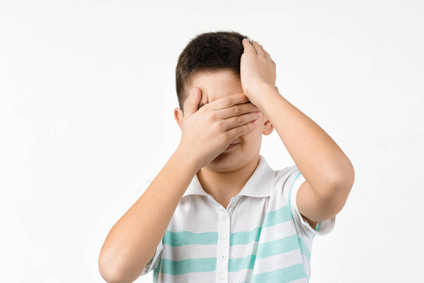 sad little child boy in striped t-shirt - Photo, Image