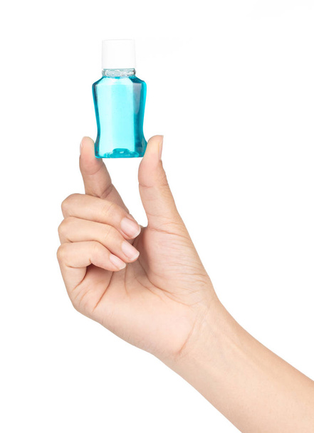 hand holding mini water mouthwash isolate on white background - Фото, изображение