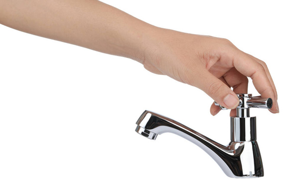 robinet tournant à la main isolé sur fond blanc
 - Photo, image