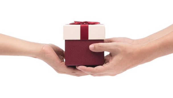 Woman's hand giving gift box to man isolated on white background - Photo, Image