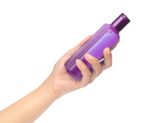 hand holding a bottle product cosmetic for skincare isolated on  - 写真・画像