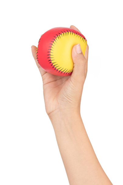 Ballspielzeug in der Hand isoliert auf weißem Hintergrund - Foto, Bild