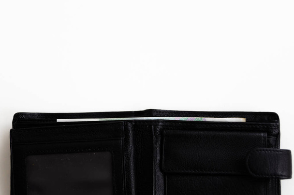 白い背景の黒い革の財布 - 写真・画像