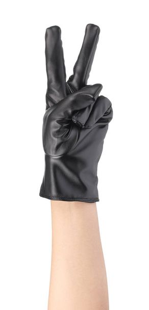 Symbol działania dłoni z czarnymi skórzanymi rękawiczkami zimowymi Izolacja  - Zdjęcie, obraz
