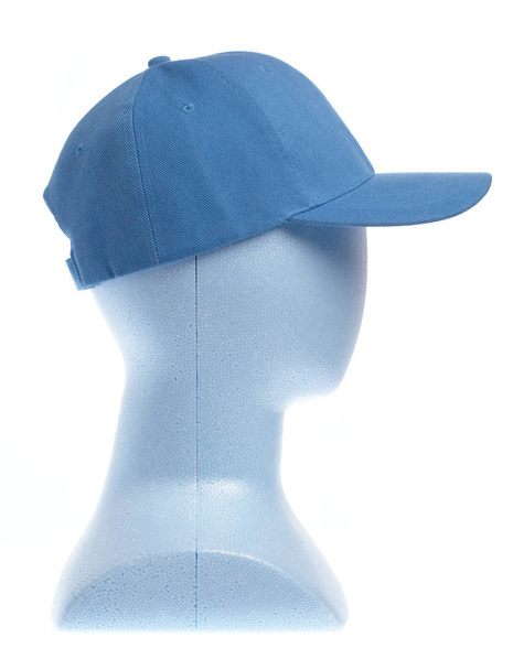 白い背景に隔離されたマネキンの頭の上の青い帽子 - 写真・画像