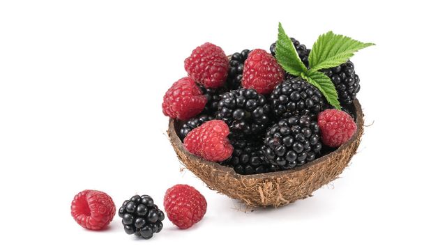 Raspberries and blackberries on white background. - Photo, Image