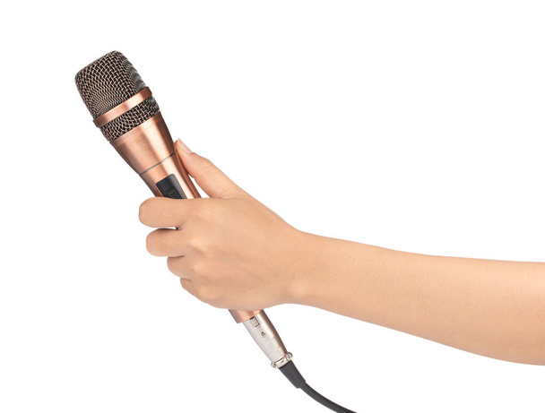 mano sosteniendo micrófono dorado aislado sobre fondo blanco
 - Foto, Imagen