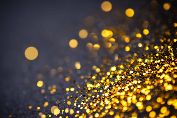 Abstract golden with black background with bokeh effect - 写真・画像