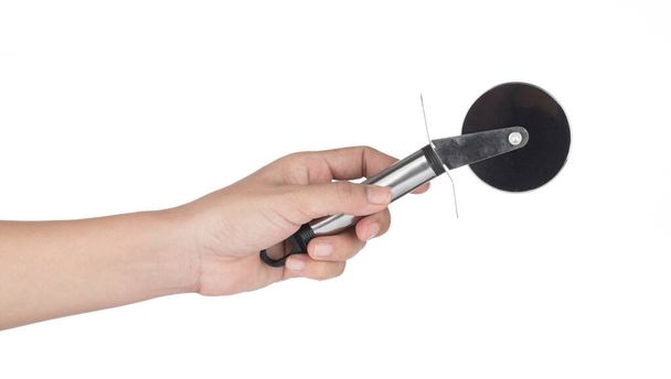 Hand holding Stainless Steel Pastry Pizza Cutter isolated on whi - Photo, Image
