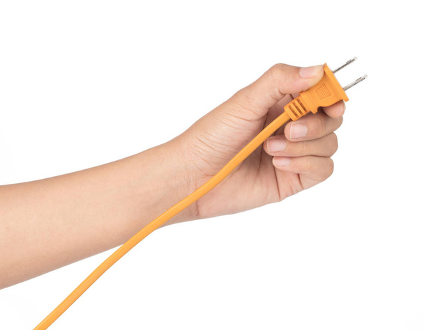 Рука тримає електричний штепсель і електричний шнур ізольовано на w
 - Фото, зображення