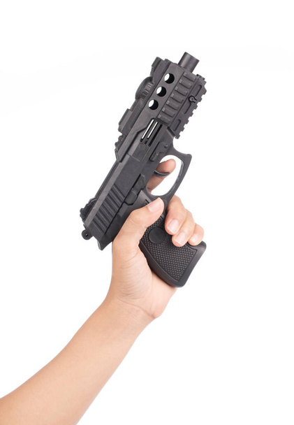 mano che gioca con una pistola giocattolo isolato su sfondo bianco
 - Foto, immagini