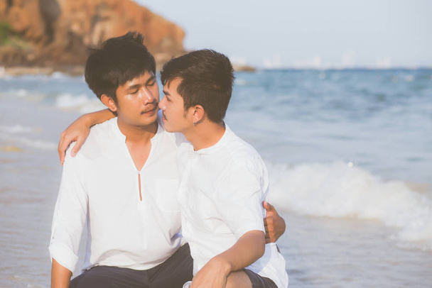 Homosexual portrait young asian couple sitting hug together on b - Photo, Image