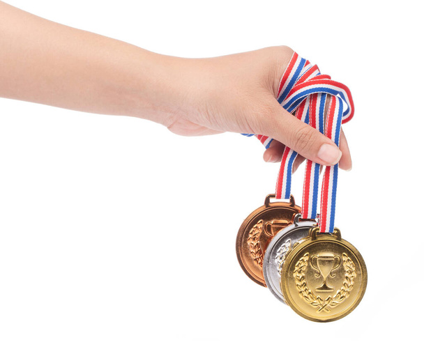hand holding set of medals awarded isolated on white background. - Photo, Image