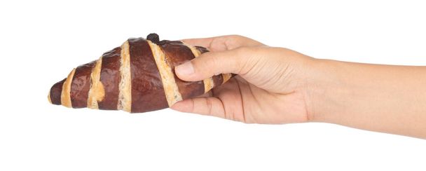 Hand holding croissant with chocolate isolated on white backgrou - Photo, Image