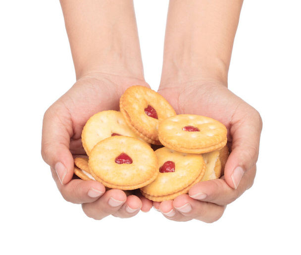 hand holding round biscuit cookies or crackers with heart with s - Fotoğraf, Görsel