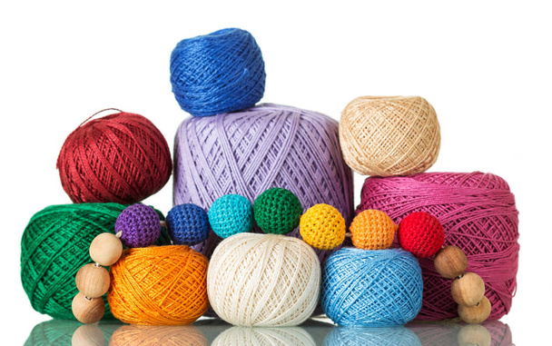 Large and small balls of multi-colored yarn, beads of thread, isolated on white - Foto, Bild