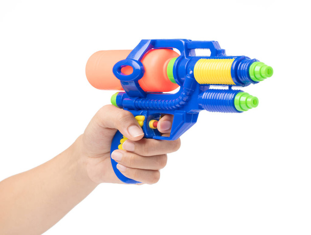 Gun water toy on hand isolated on a white background - Photo, image