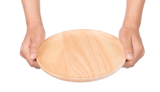 hand holding Empty wooden plate isolated on white background - Photo, Image