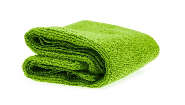 Rouleaux de serviettes vertes isolés sur fond blanc
. - Photo, image