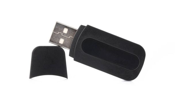A black of USB flash memory isolated on a white background. - 写真・画像