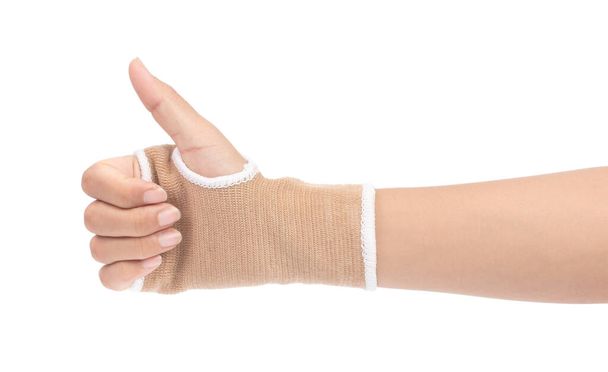 hand showing thumbs up with wrist support isolated on white back - Photo, Image