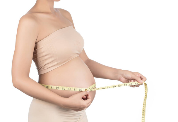Žaludek těhotné ženy a měřicí páska izolované na - Fotografie, Obrázek