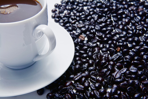 Traditional cup of coffee and coffee beans roasted - Photo, Image