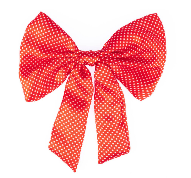 Red bow with white dots isolated on white background. - Photo, image
